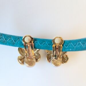 Elegant Gold and White Earrings with Floral Accents